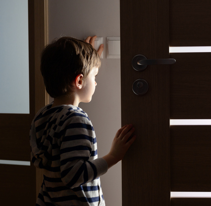Little boy entering a room